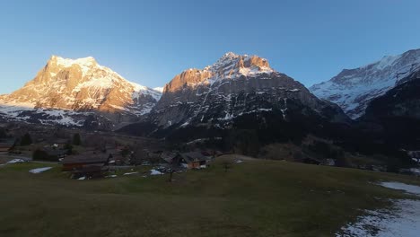 Golden-light-on-distant-mountain-peaks-in-Swiss-Alps