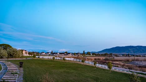 Sunset,-twilight,-to-nighttime-panoramic-time-lapse-of-a-suburban-neighborhood-in-spring