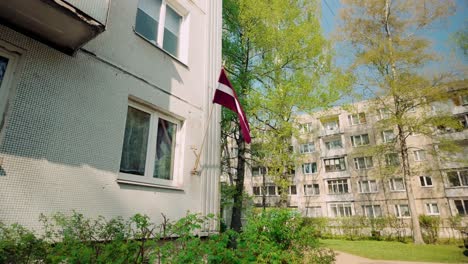 Latvian-national-flag-blows-on-apartment-condo-in-Imanta-suburb-Riga