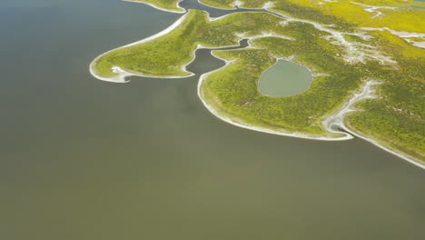 Aerial-panoramic-drone-of-Alkali-Soda-Lake-landscape-water-bay-near-grassland-meadow-california-American-Natural-historic-site-Shot