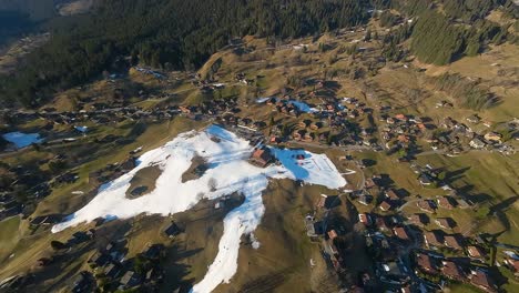 Aerial-view-of-Grindelwald,-Switzerland-ski-slopes-and-housing