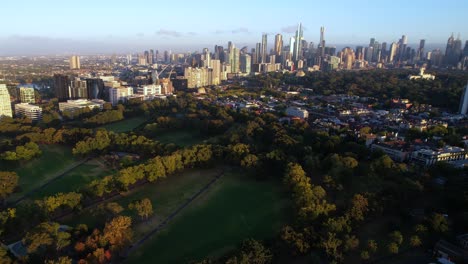 Aerial-View-of-Melbourne,-Australia,-Downtown-Buildings-From-Fawkner-Park-at-Sunrise,-Drone-Shot