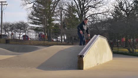 person-slides-down-rail-at-the-skatepark
