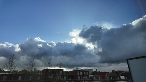 Timelapse-video-of-sun-and-clouds-over-a-residential-area