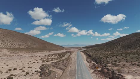 Lonely-road-in-arid-landscape-of-Salta-province,-Argentina