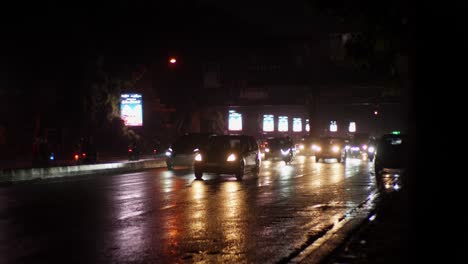 Melatimas-Villa-is-nestled-along-main-road,-near-BSD-City,-amidst-wet,-rainy-traffic-under-the-veil-of-night
