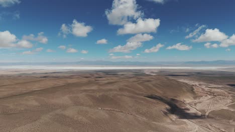 Aerial-view-landscape-of-extensive-and-arid-plateau-of-the-natural-salt-flat-of-Salinas-Grandes,-Jujuy,-Argentina