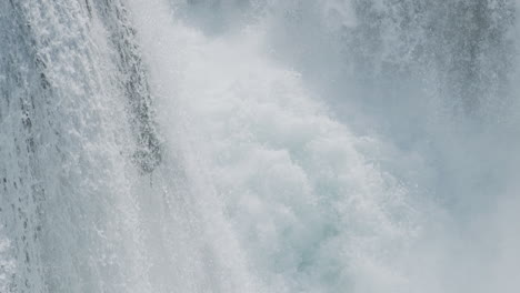 A-waterfall-with-a-large-amount-of-water-on-a-clean-and-wild-mountain-river