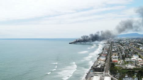 pier-on-fire-with-black-smoke