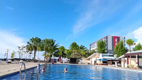 Swimming-pool-in-the-Maleo-hotel-area,-Mamuju-with-blue-sky