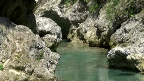 crystal-clear-Tolminka-river-in-gorge-in-triglav-national-park,-slovenia,-static-shot