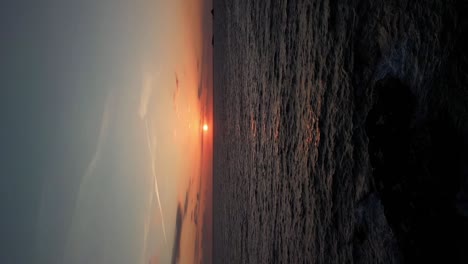 Vertical-Sunrise-Over-the-Cornish-Atlantic-Ocean-in-Cornwall-from-an-Aerial-Drone