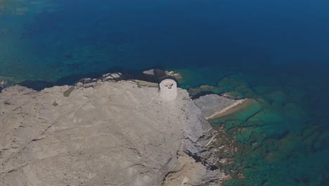 Aerial-Drone-Tops-Down-Torre-D'es-Colomer-Spanish-Blue-Sea-Architecture-Travel-Spot-in-natural-cliff
