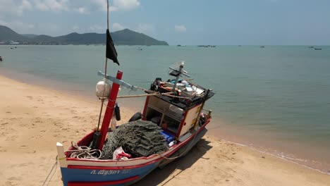 Wooden-Thai-fishing-boat-on-sandy-beach