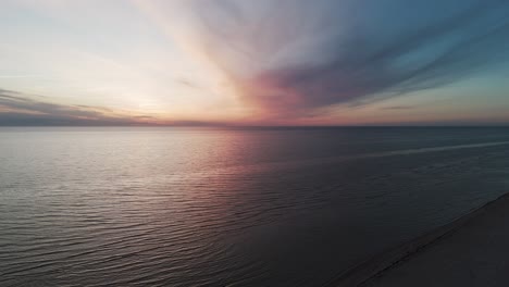 Beautiful-Aerial-Establishing-View-of-Baltic-Sea-Coast-on-a-Sunny-Evening-at-Bernati,-Latvia