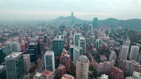 Aerial-view-over-the-El-golf-neighborhood,-hazy-evening-in-Santiago-de-Chile