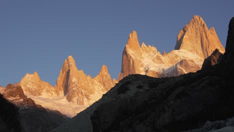 Golden-light-bathes-Mount-Fitz-Roy-in-Patagonia-in-a-powerful-light-and-shadow-contrast