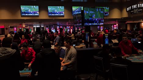 Las-Vegas-USA,-People-Sitting-and-Gambling-on-Blackjack-Tables-in-Hotel-Casino