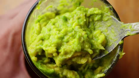 Spoonful-Of-Fresh-Smash-Avocado-In-A-Glass