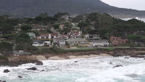 Carmel-by-the-Sea,-California-waterfront-beach-mansions-by-the-point-of-the-peninsula---aerial
