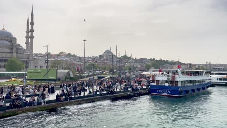 Istanbul-Scenery-with-Ferry-on-Bosporus-Strait-next-to-Mosque-with-Locals