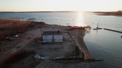 Aerial-view-of-an-old-building-on-the-shores-of-Warwick-cove-inlet,-Rhode-Island