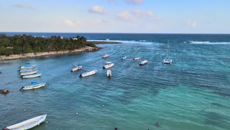 Drone-shot-of-the-Akumal-coast-with-boats-floating