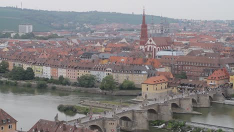 Bamberg-with-historic-architecture-and-river-flowing-through-the-city,-daytime,-aerial-view