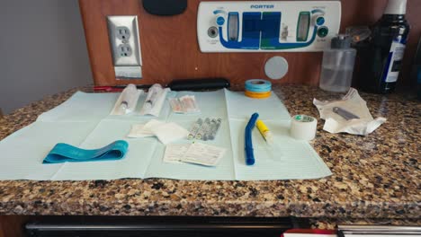 panning-shot-of-dental-equipment-and-medicine-neatly-laid-out-on-a-countertop