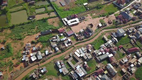 Canal-and-small-homes-in-residential-area-of-Bukasa,-Kampala,-Africa