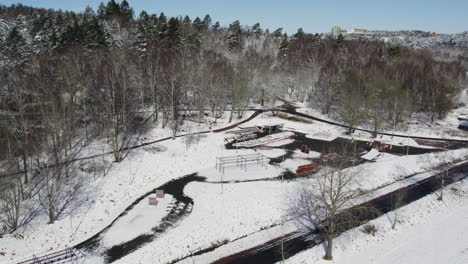 Kviberg-Hinderbana-or-Obstacle-Course,-Winter,-Aerial-Establishing-shot