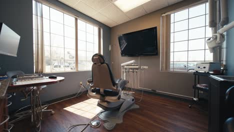 wide-push-in-of-a-dental-office-or-teeth-cleaning-room-surrounded-by-windows