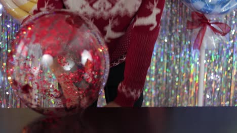 Blowing-up-a-plastic-sphere-to-make-Christmas-ornaments