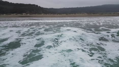 surfing-the-waves-with-drone,-northern-coast-of-chile