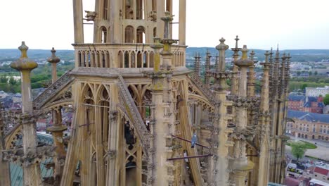 Metz-Cathedral-in-France-Circulating-Exterior-Pillars,-Wide-Drone-Shot