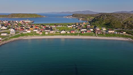 Aerial-tracking-shot-in-front-of-the-Vestersanden-beach,-summer-in-Pykeija,-Norway