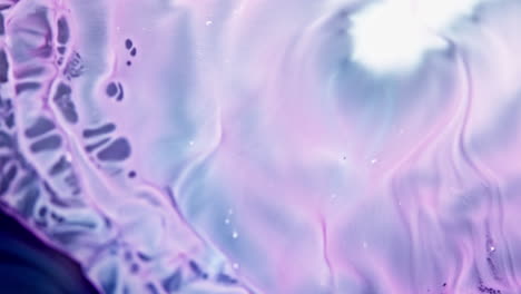 Vibrant-pink-and-purple-ink-swirling-in-water,-creating-an-abstract,-fluid-art