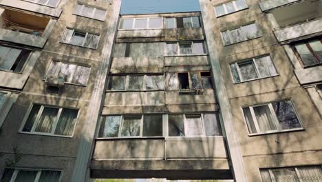 Moving-under-facade-of-Khrushchevka-concrete-panel-apartment-building