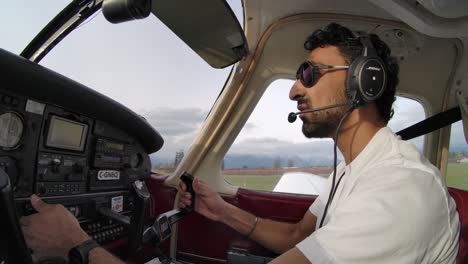 Male-Private-Pilot-in-Cockpit-of-Small-Airplane---Profile-View-SLOMO