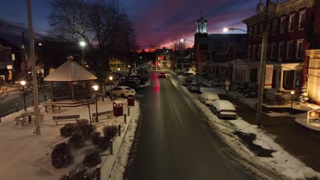 Snow-covered-town-square-in-USA-during-sunset