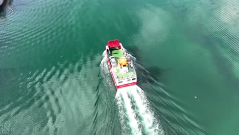 Drone-flying-over-small-car-ferry-Castletownbere-West-Cork-Ireland-on-a-bright-summer-morning