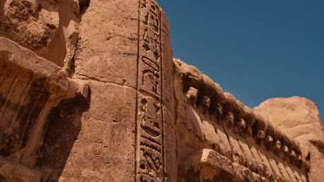 Ancient-hieroglyphs-on-the-wall-of-Philae-temple-complex-in-closeup-shot