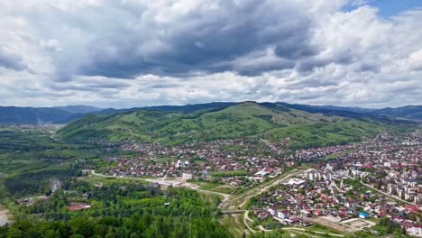 Hyperlapse-video-captures-Gura-Humorului-cityscape,-Romania-on-a-sunny-and-cloudy-day