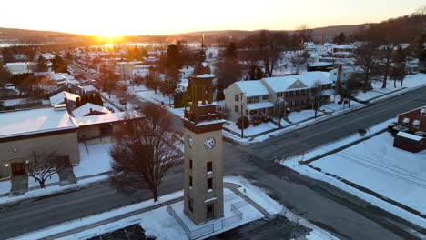 Clock-tower-in-Columbia,-Pennsylvania-during-winter-sunset-with-snow