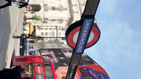 Vertical-video-of-Piccadilly-Circus-Underground-Station's-entrance-in-London,-England