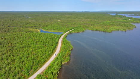 Drone-tracking-a-RV-driving-at-lake-Inarinjarvi-in-distant-north-Finland
