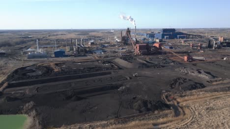 An-expansive-industrial-plant-and-coal-mines-during-the-day,-aerial-view