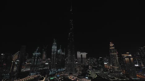 Dubai-downtown-skyline-with-world's-tallest-buildings-in-the-night-lighting-Aerial-view