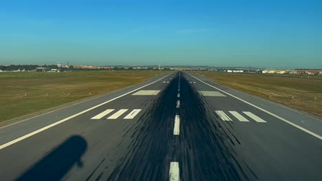 Silhouette-of-a-modern-jet-over-the-runway-in-a-real-time-landing