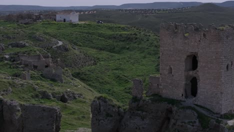 drone-flight-leaving-on-one-side-the-9th-century-castle-of-Oreja-on-the-other-side-there-are-structures-in-ruins-and-this-is-the-hermitage-of-the-depopulated-Oreja-Otigola-Toledo-Spain